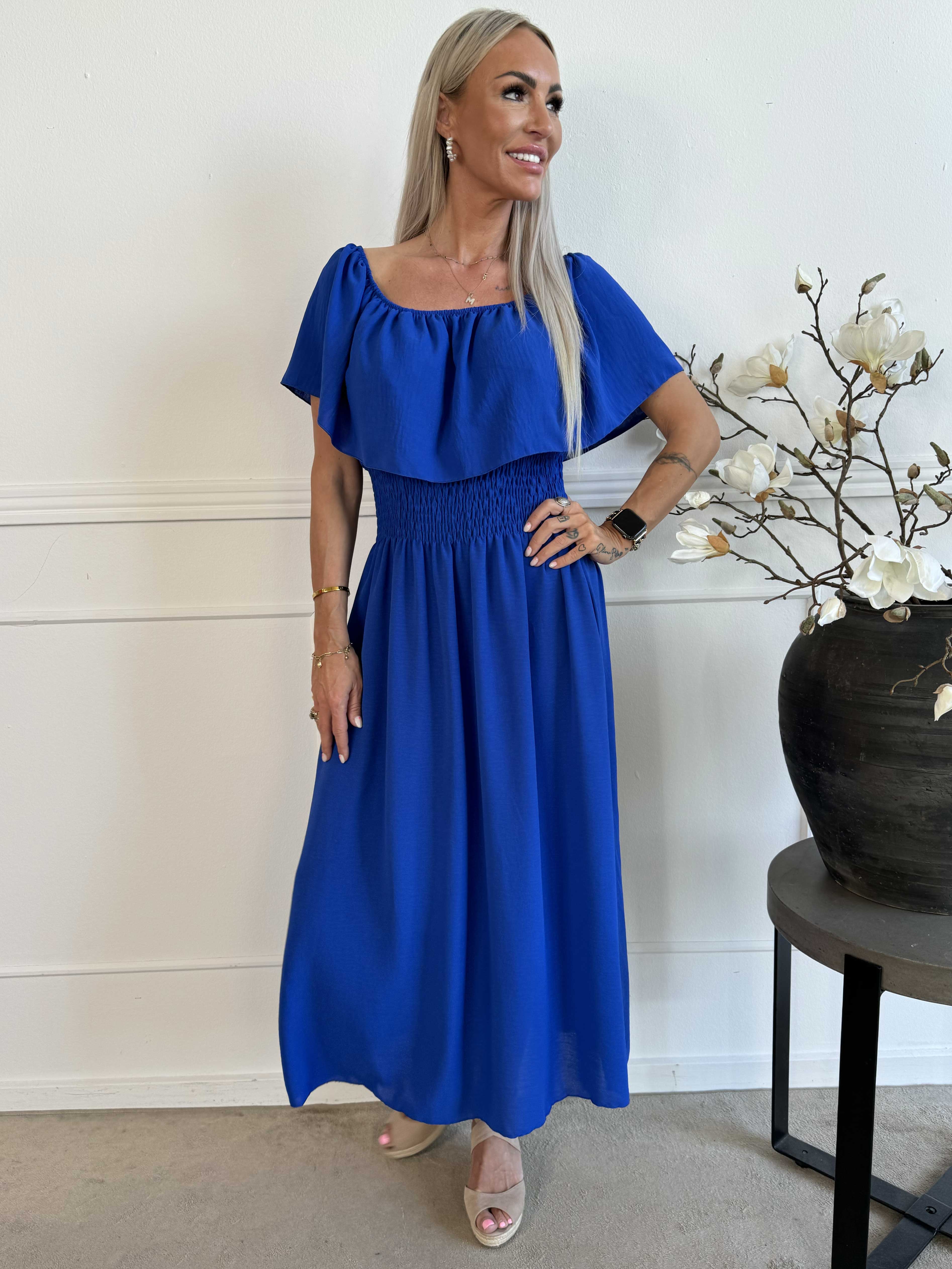 Rachel - Lång klänning med fickor och volang i nederkanten